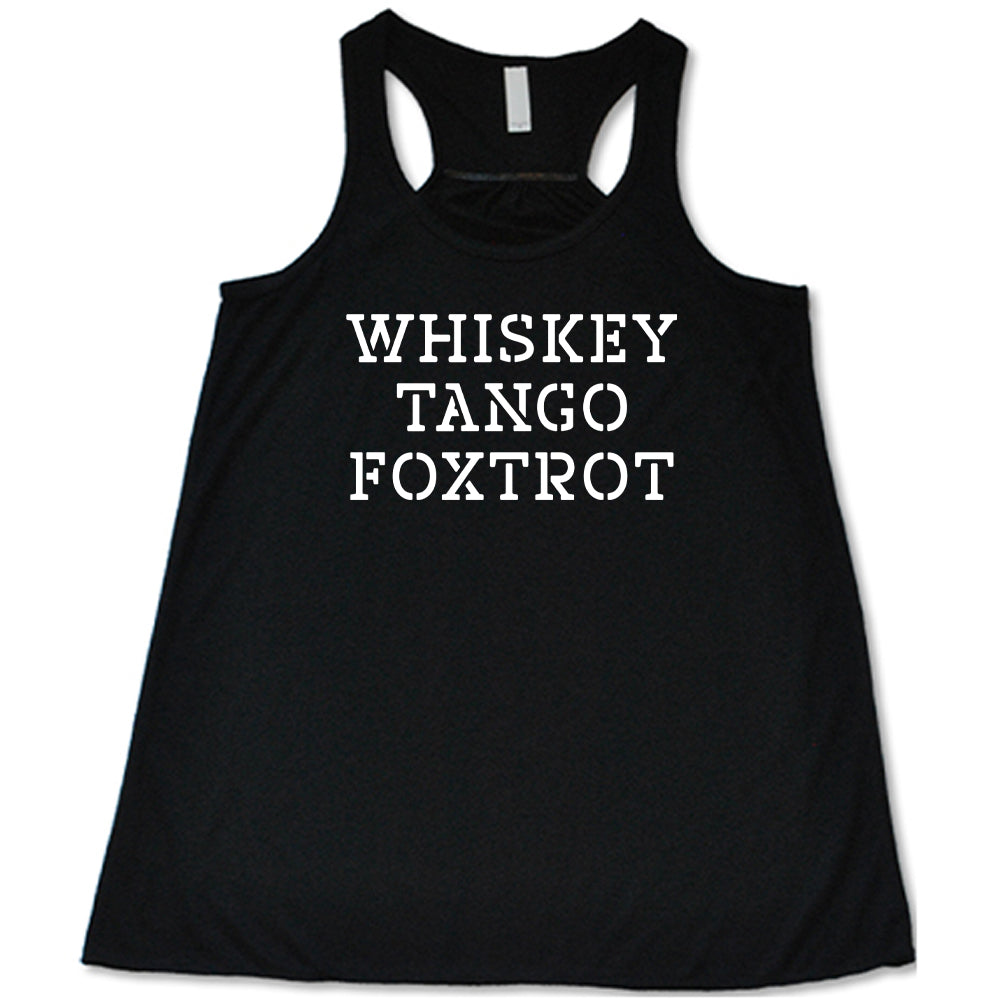 black shirt with the quote "Whiskey Tango Foxtrot" on it