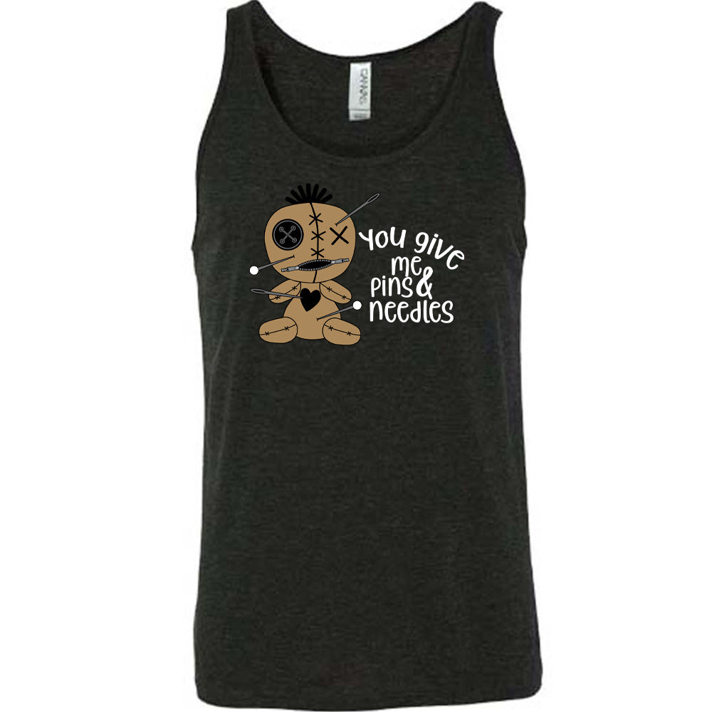 black shirt with a voodoo doll graphic and the quote "You Give Me Pins And Needles" on it