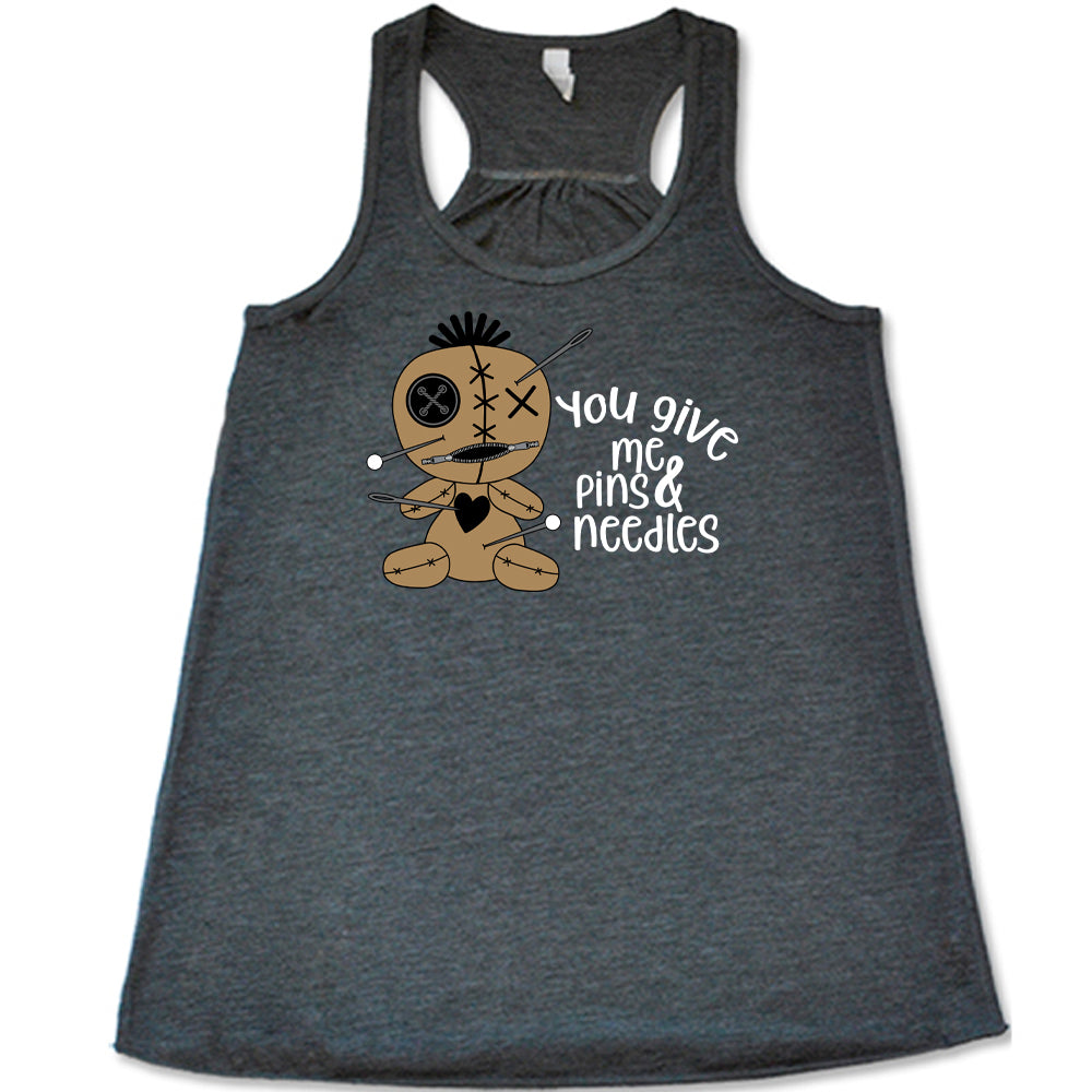 grey shirt with a voodoo doll graphic and the quote "You Give Me Pins And Needles" on it