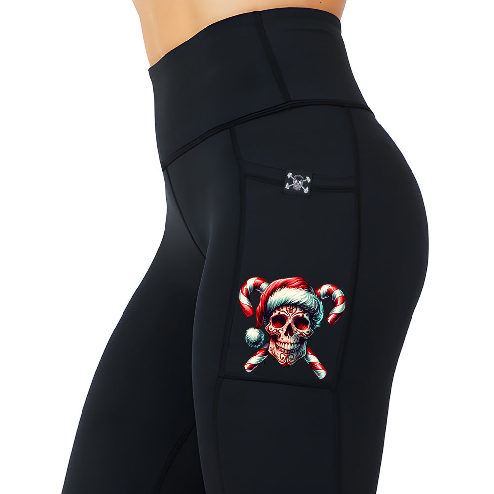 black leggings with a candy cane skull graphic on it