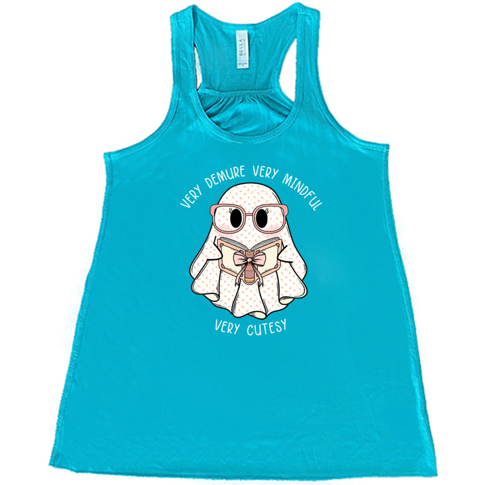 teal shirt with a ghost graphic and "very demure very mindful very cutesy" text on it