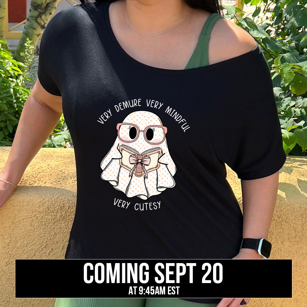 shirt with a ghost graphic and "very demure very mindful very cutesy" text on it coming soon