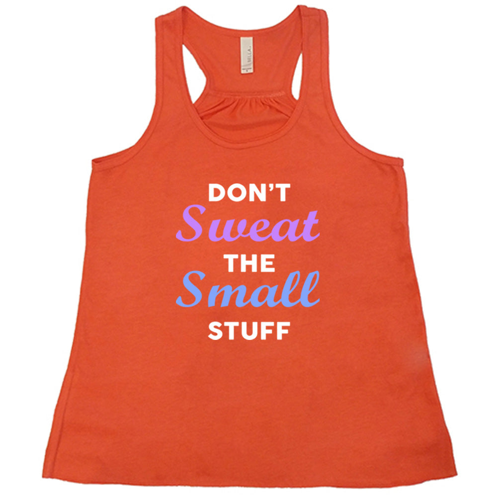 coral shirt with the quote "Don't Sweat The Small Stuff" on it