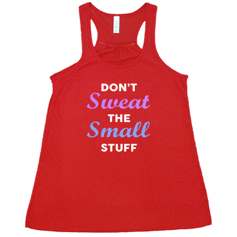 red shirt with the quote "Don't Sweat The Small Stuff" on it