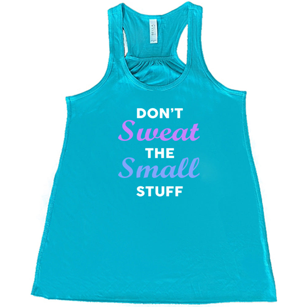 teal shirt with the quote "Don't Sweat The Small Stuff" on it