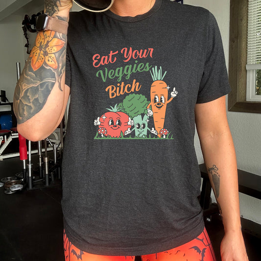 black shirt with the text "Eat Your Veggies Bitch" on it