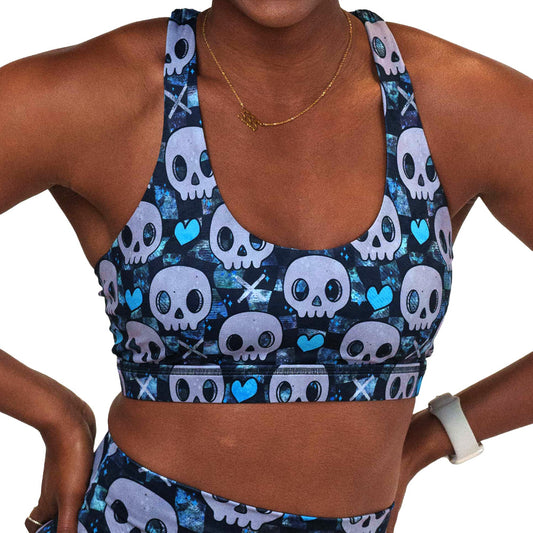 blue hearts and skulls patterned sports bra