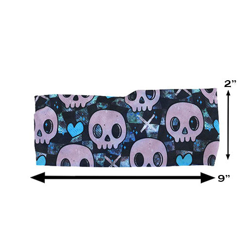 blue hearts and skulls patterned headband measured at 2 by 9 inches