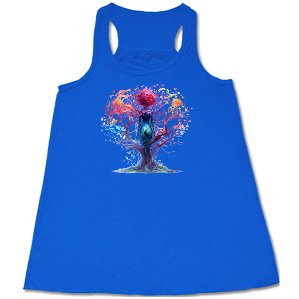 blue shirt with a colorful enchanted tree graphic in the center