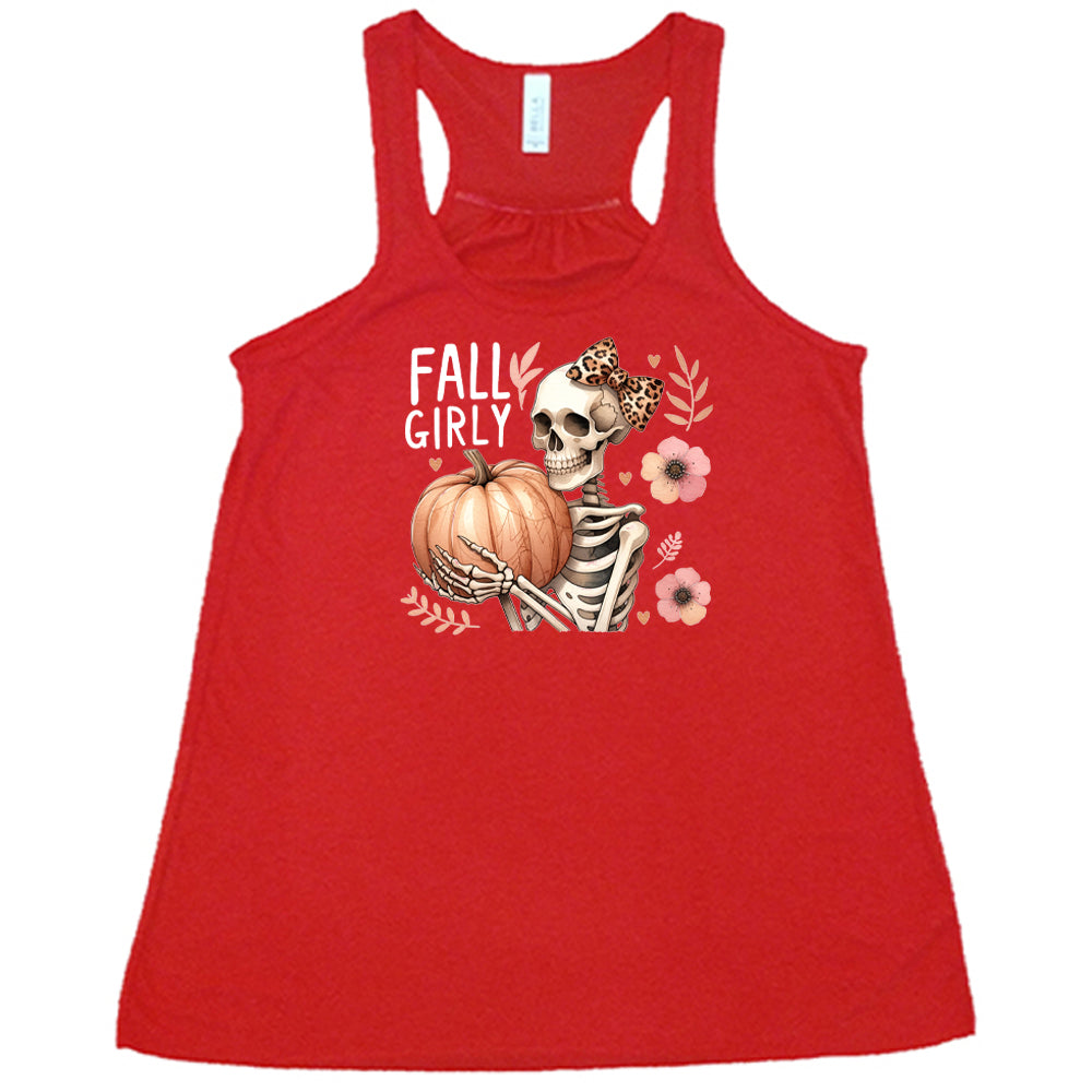 red shirt with a skeleton and the quote "fall girly" on it