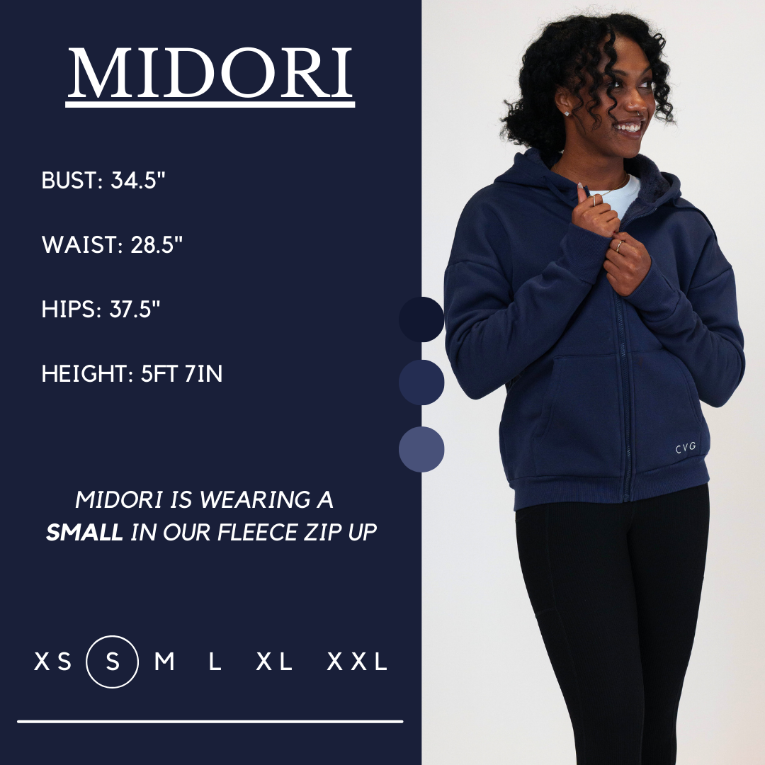 Model’s measurements of 34.5” bust, 28.5” waist, 37.5” hips and height of 5 ft 7 inches. She is wearing a size small in our fleece zip up