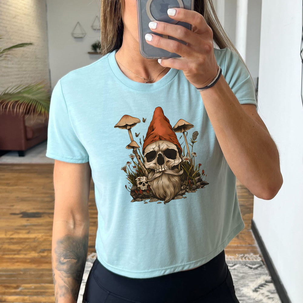 light blue cropped tee with a gnome skull graphic in the center