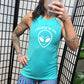 teal muscle tank top with a "I believe in you" quote and alien head design on it