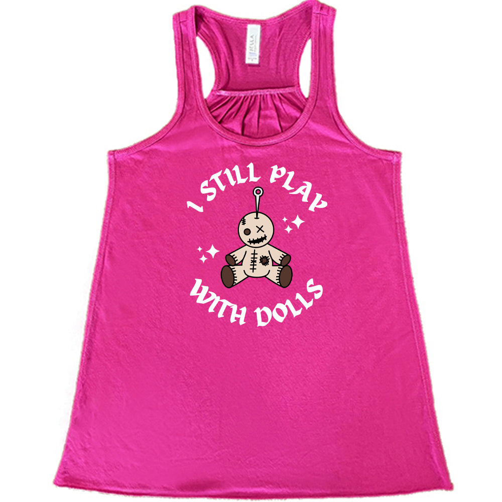 berry shirt that has a voodoo doll graphic and the text "i still play with dolls" on it