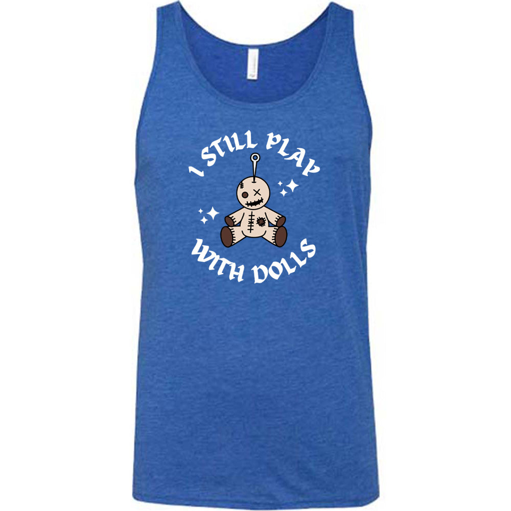 blue shirt that has a voodoo doll graphic and the text "i still play with dolls" on it