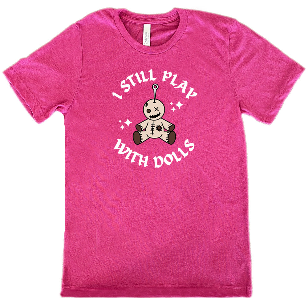 berry shirt that has a voodoo doll graphic and the text "i still play with dolls" on it