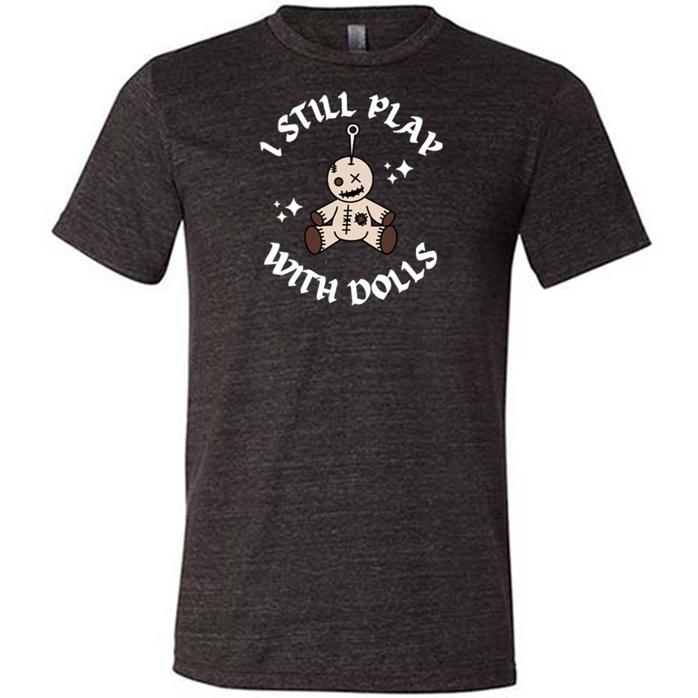 black shirt that has a voodoo doll graphic and the text "i still play with dolls" on it