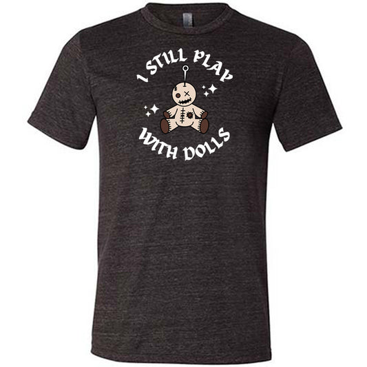 black shirt that has a voodoo doll graphic and the text "i still play with dolls" on it