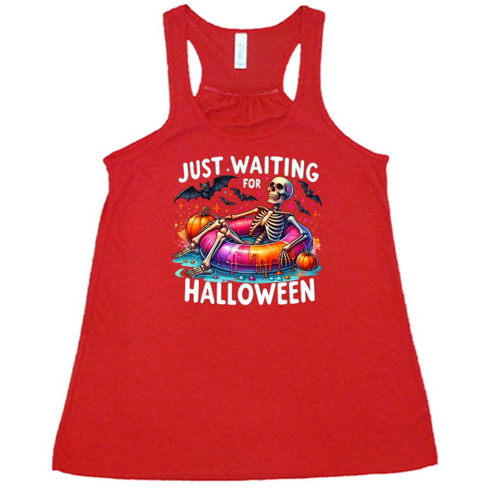 red shirt with a colorful skeleton graphic in the center with the quote "Just Waiting For Halloween" on it