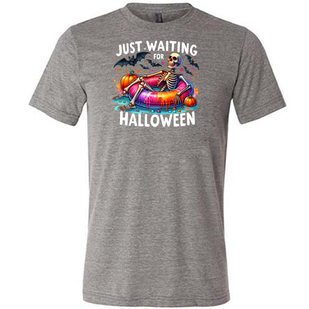 grey shirt with a colorful skeleton graphic in the center with the quote "Just Waiting For Halloween" on it