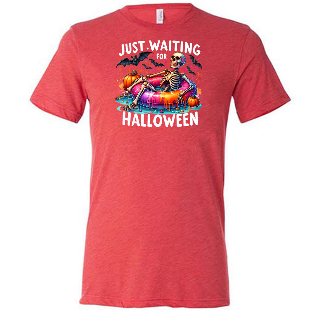 red shirt with a colorful skeleton graphic in the center with the quote "Just Waiting For Halloween" on it