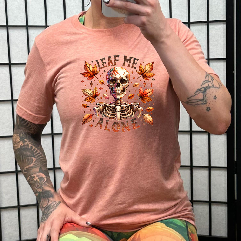 peach "Leaf Me Alone" shirt