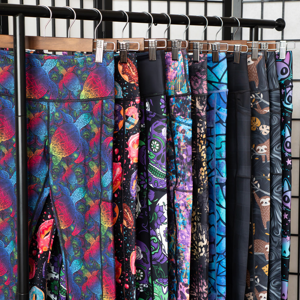 photo of different legging patterns hanging up on a clothing rack