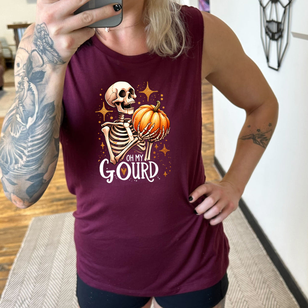 maroon shirt with a skeleton holding a pumpkin graphic on it