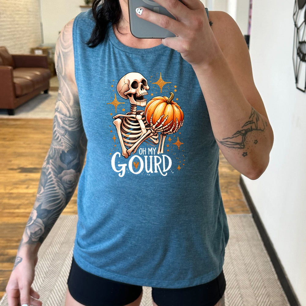 teal shirt with a skeleton holding a pumpkin graphic on it