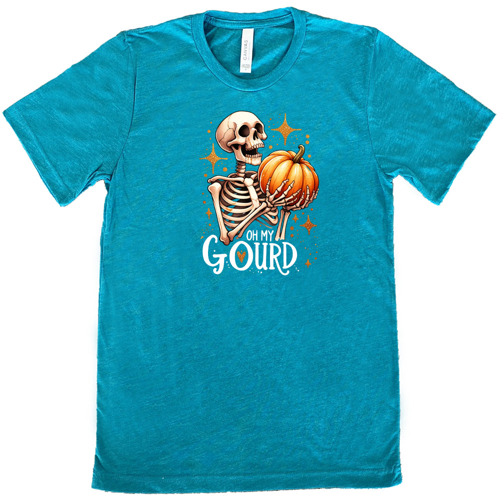 teal colored shirt with a skeleton holding a pumpkin graphic on it