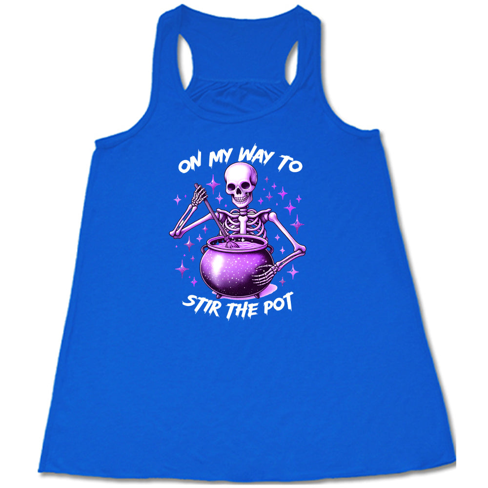 blue cropped tee with a skeleton graphic and the quote "on my way to stir the pot" on it