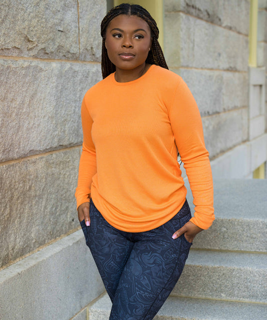 model wearing the solid orange thermal