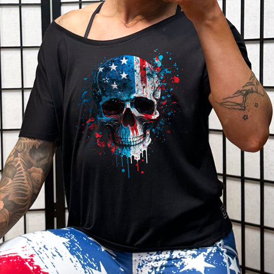 black slouchy tee with a paint splattered american flag skull on it