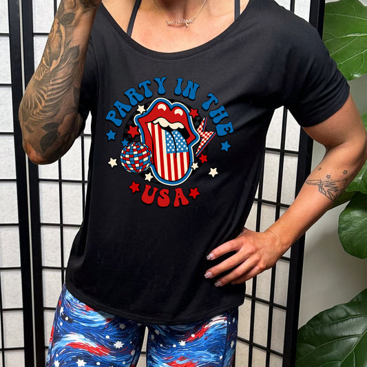 black slouchy tee with the saying "party in the usa" and a american flag tongue out image & disco ball