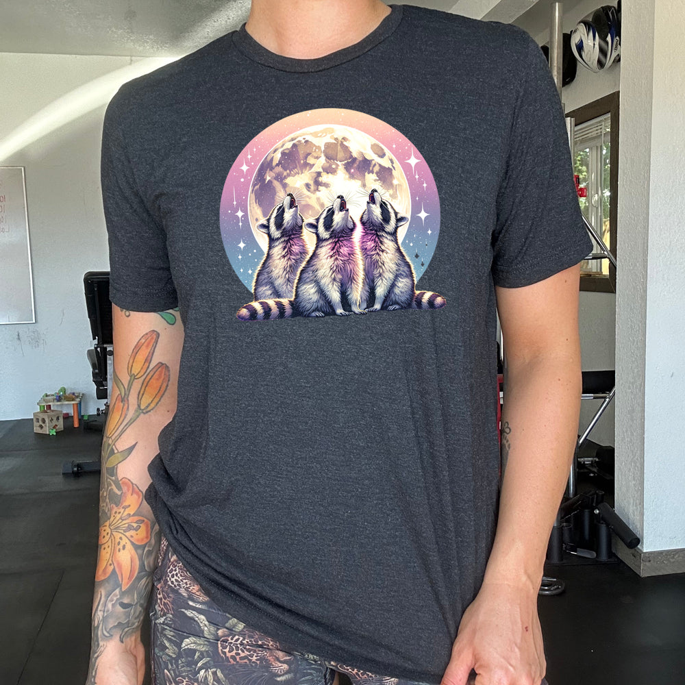 black shirt with a raccoon and moon graphic on it