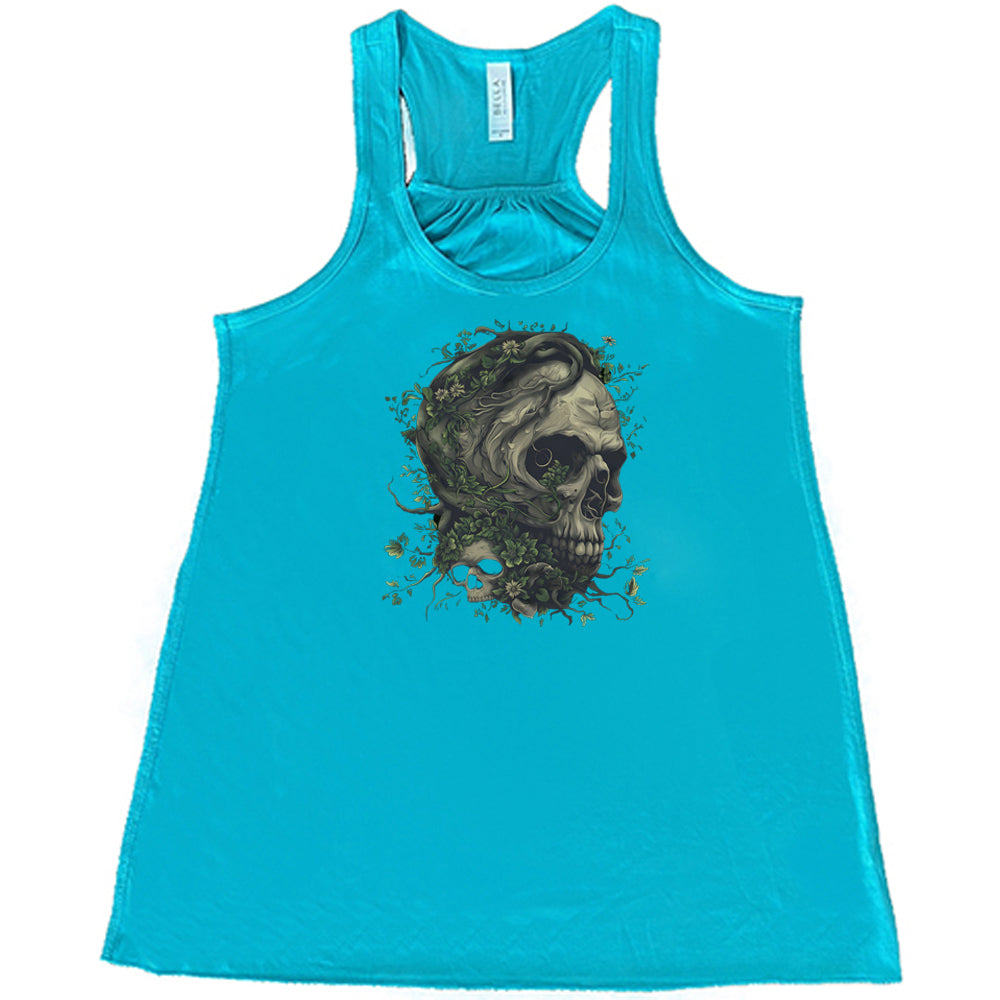 teal shirt with a tree skull graphic in the middle