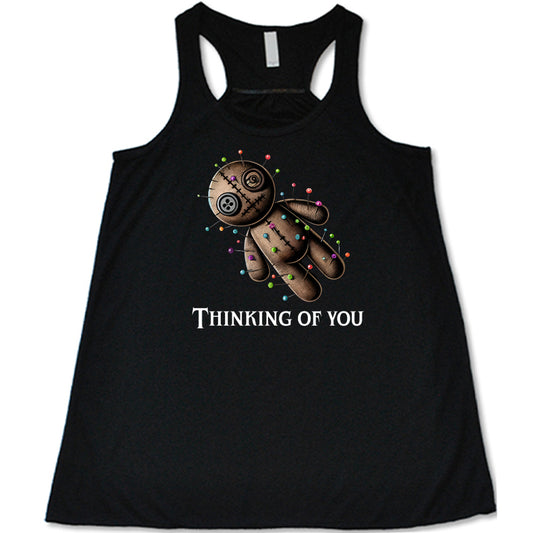 black shirt with the quote "Thinking Of You" on it