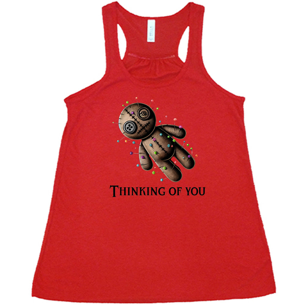 red shirt with the quote "Thinking Of You" on it