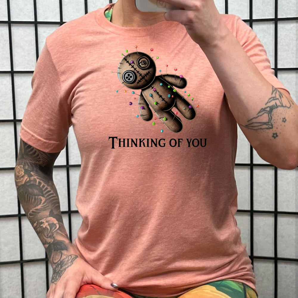 peach shirt with the quote "Thinking Of You" on it