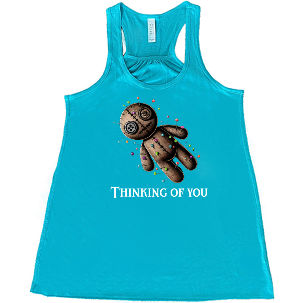 teal shirt with the quote "Thinking Of You" on it