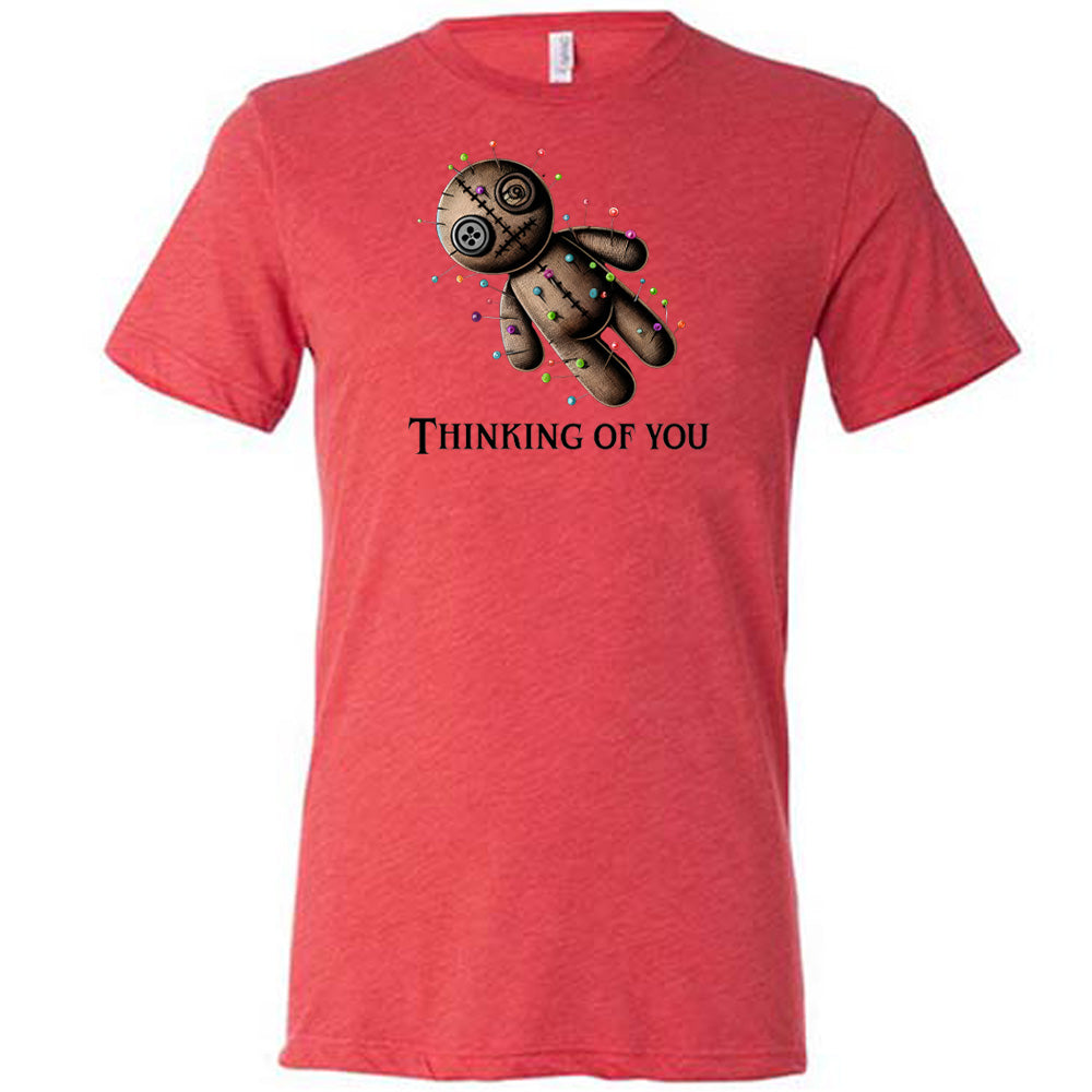 red shirt with the quote "Thinking Of You" on it