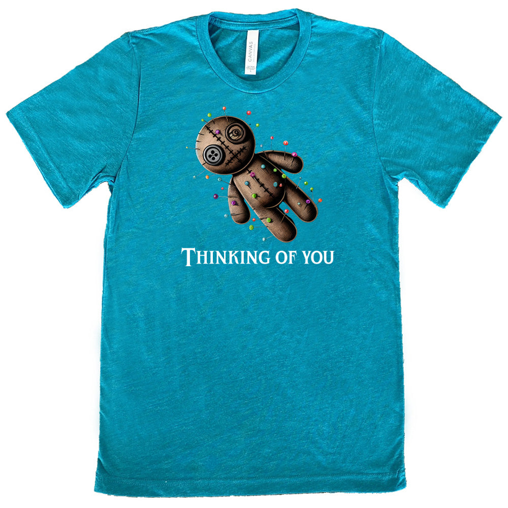 teal shirt with the quote "Thinking Of You" on it