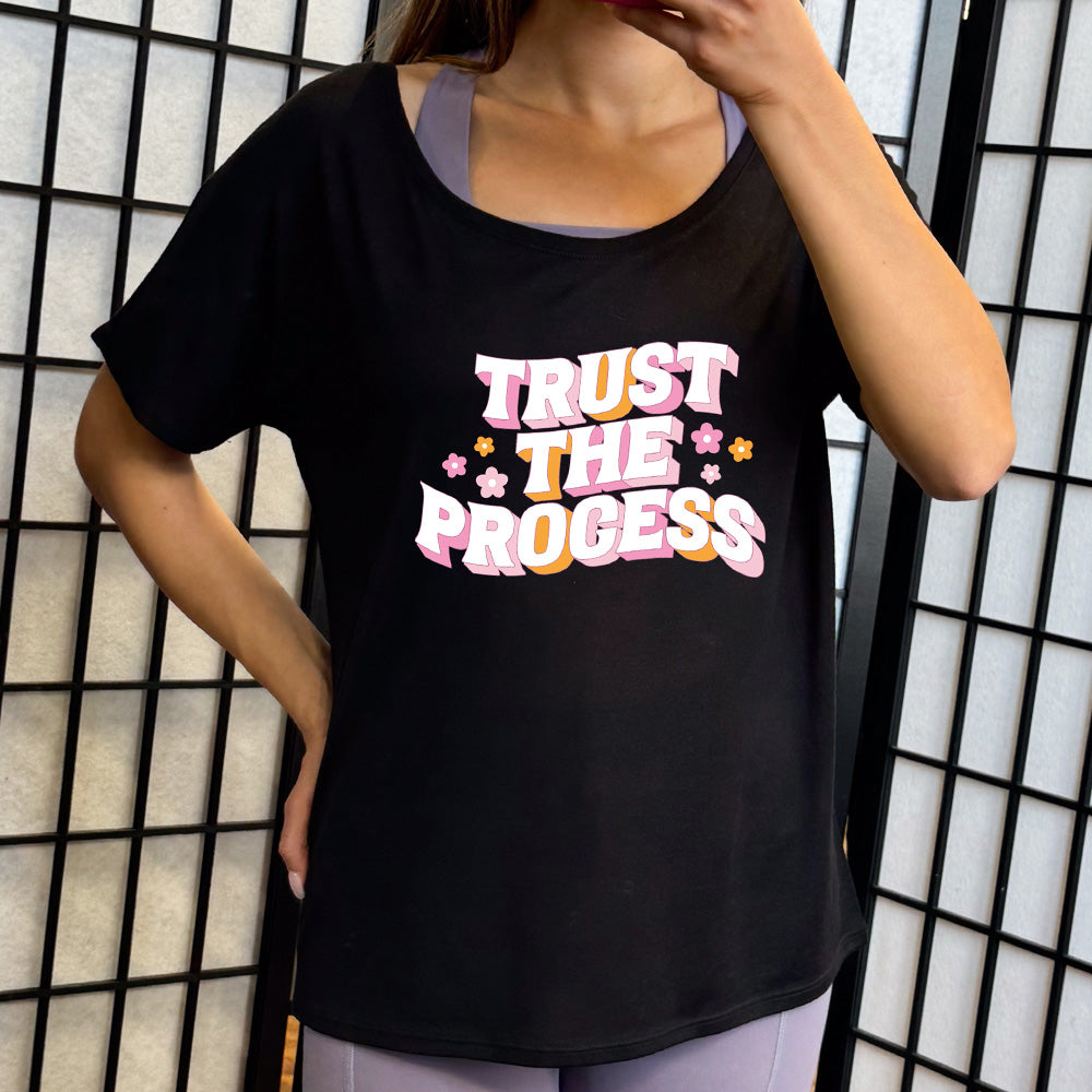 black slouchy shirt with the text "Trust The Process" on it