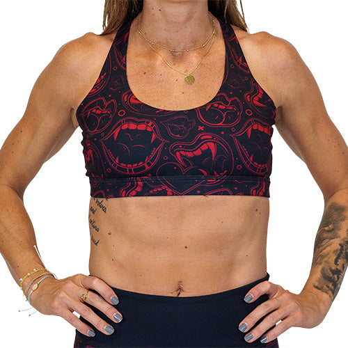 front of red and black vampire themed sports bra