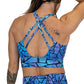 back view of butterfly back strap design on blue and purple stained glass print longline bra