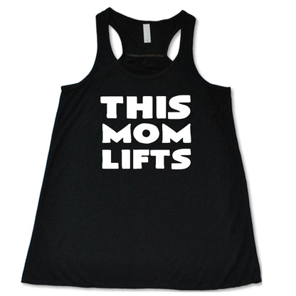 black racerback shirt with the saying "this mom lifts" in the center in white lettering 